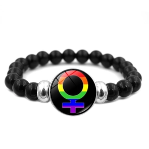 Macro shot of LGBTQ+ Pride beaded bracelet with rainbow Venus charm and black beads