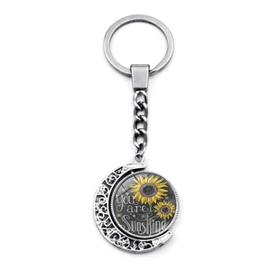 Rotating moon keychain with yellow sunflower and You are my sunshine engraving