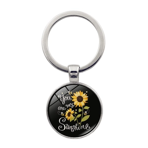 Sunflower and bee keychain with 'You are my Sunshine' quote pendant on white background