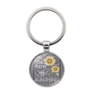 Silver sunshine sunflower keychain with bee pattern and You Are My Sunshine quote