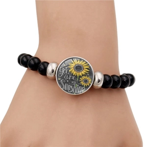 Bracciale elastico con perline nere You Are My Sunshine e ciondolo a girasole