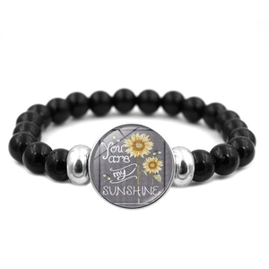Bracciale elastico con perline di ossidiana nera e ciondolo girasole You Are My Sunshine