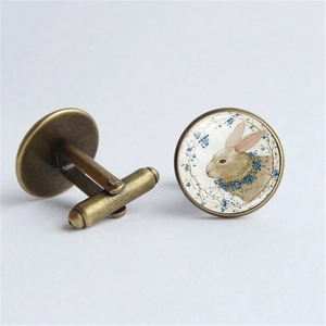 Vintage bronze rabbit cufflinks with glass dome and floral bunny illustration for men