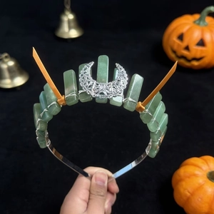 Handmade green crystal crown headpiece with crescent moon and orange spike accents