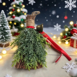 Detailed close-up of decorative Christmas broom with pine needles, red ribbon and brass bell