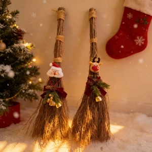 Macro detail of Christmas broom decor with Santa Claus and Reindeer plush figures