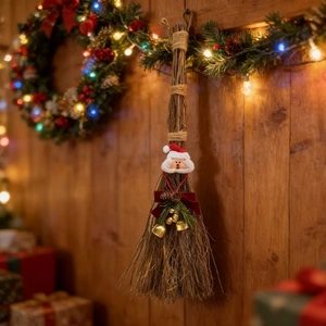 Handcrafted Christmas broom decoration with Santa mask and pine cones on wood wall