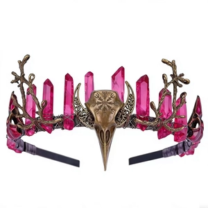Detail of raven skull headpiece with pink crystal points and Viking compass engraving