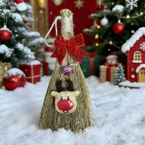 Detail view of a handmade straw Christmas broom with a plush reindeer and red bow