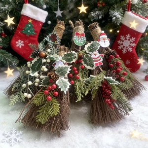 Set of four rustic Christmas decorative brooms with holly berries and pine cones