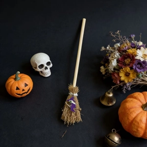 Mini Halloween witch broom with purple enamel pendant and rustic straw fibers