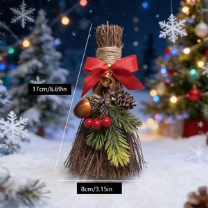 Close-up of decorative Christmas broom with pine cones, red berries and golden bell detail