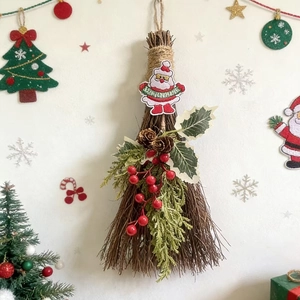 Christmas decorative broom with Santa patch, pine cones and berries for holiday home decor