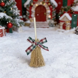 Mini Christmas broom ornament with red plaid bow tie and rustic straw texture detail