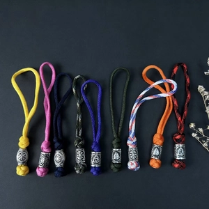 Detailed view of handmade paracord keychains with vintage silver Viking metal beads