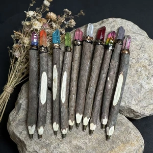 Handcrafted natural wood ballpoint pens topped with colorful raw crystal gemstones