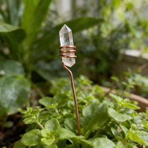 Natural clear quartz crystal point wrapped in copper wire for floral arrangement decoration