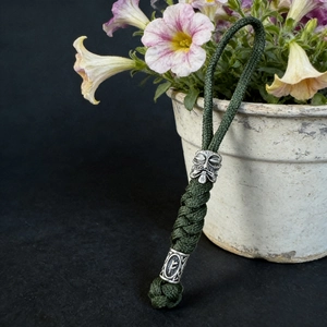 Handmade Viking paracord keychain with olive green cord and silver mask metal beads