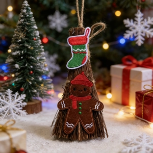 Christmas embroidery patches with gingerbread man and red stocking on a decorative broom