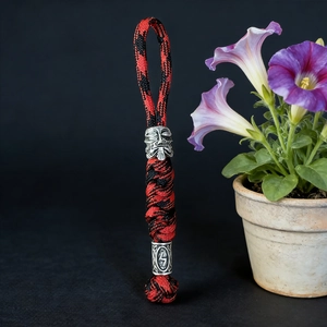 Handmade red and black paracord keychain with silver Spartan mask bead and Viking runes