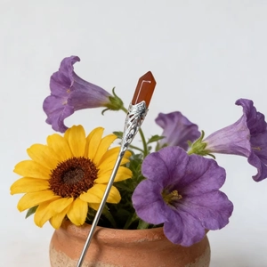 Silver hair pin with hexagonal red crystal set in an ornate floral decorative vase