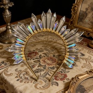 Detail of sun goddess crown with iridescent crystal points on a gold halo headband