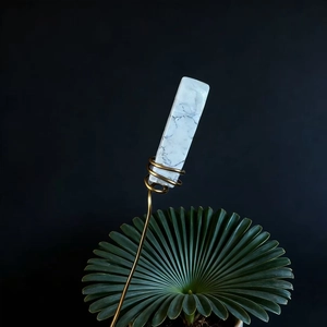 Detail of natural white crystal stick with gold copper wire for flower arrangement