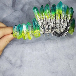 Detail of handmade crystal crown with crescent moon and wire-wrapped gradient stones