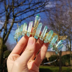 Handmade bohemian crystal crown with gold wings and wire-wrapped rainbow quartz crystals