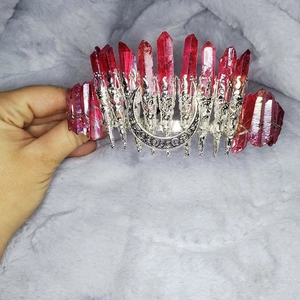 Detailed macro view of red crystal crown headband with silver crescent moon metal accent