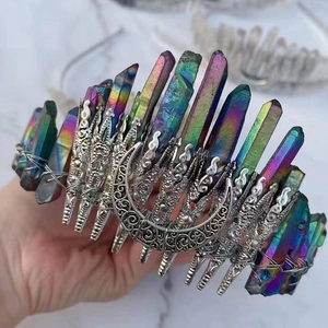 Detail of handmade rainbow crystal crown with metallic moon ornament and wire wrap