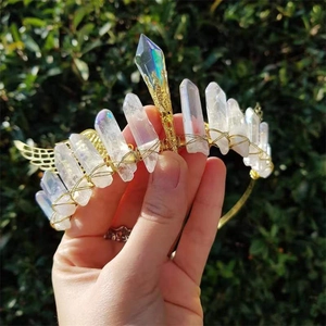 Handmade gold wire-wrapped natural white crystal crown with wings on a bridal headband