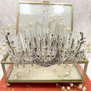 Handmade celestial crown featuring natural white crystals, silver moon and star elements