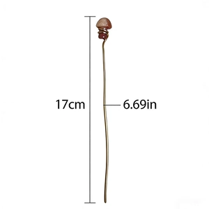 Handmade mushroom hair pin with red agate and copper wire on white background
