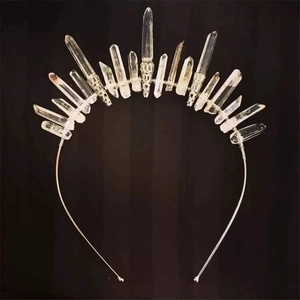 Detail of handmade crystal crown headband with natural white quartz on metal frame