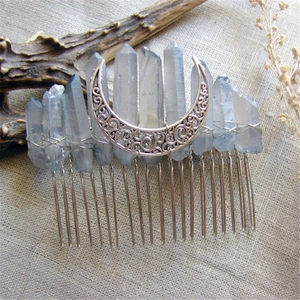 Detailed view of wicca crescent moon hair comb with light blue natural crystal stones