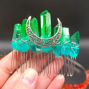 Detailed view of silver crescent moon moon and gradient green crystal wedding hair comb