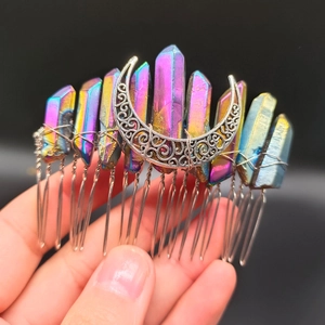 Macro detail of wicca bridal hair comb with aura crystals and silver crescent moon