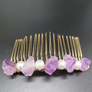 Detail of handmade gold hair comb featuring raw natural amethysts and white pearls
