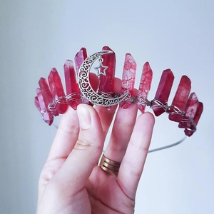Macro shot of dark red wiccan crystal crown with silver moon and star charms