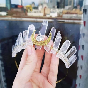 Handmade crown headband with natural white crystals and a golden moon ornament
