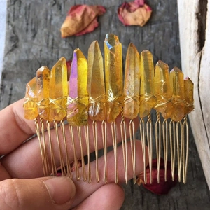 Detailed view of handmade Wicca hair comb with yellow raw crystals and gold wire wrapping