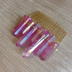 Detailed close-up of handmade purple crystal points wired onto a golden hair comb