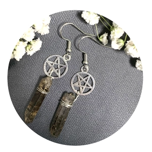 Bohemian pentagram star earrings with smoky quartz crystal points on a grey background