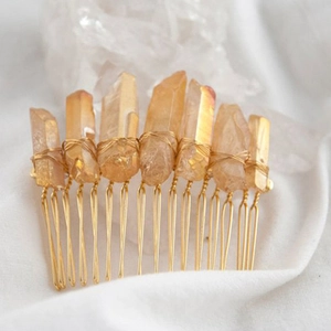 Close-up of golden wire-wrapped amber crystals on a handmade Wicca bridal hair comb