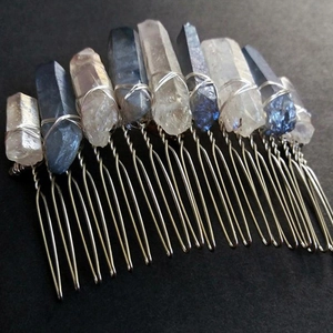 Detail of bohemian silver hair comb with white and dark blue raw quartz crystals