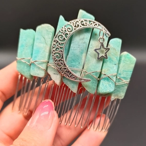 Detail of celestial hair comb with blue crystal stones and silver moon star charms