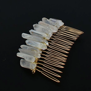 Detailed view of handmade Wicca hair comb with natural raw crystals and gold wire wrap