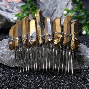 Detail of handmade gold aura quartz crystals wired to a silver bridal hair comb base