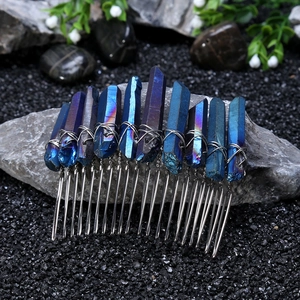 Detailed macro view of rainbow blue crystal points wire-wrapped on a silver comb